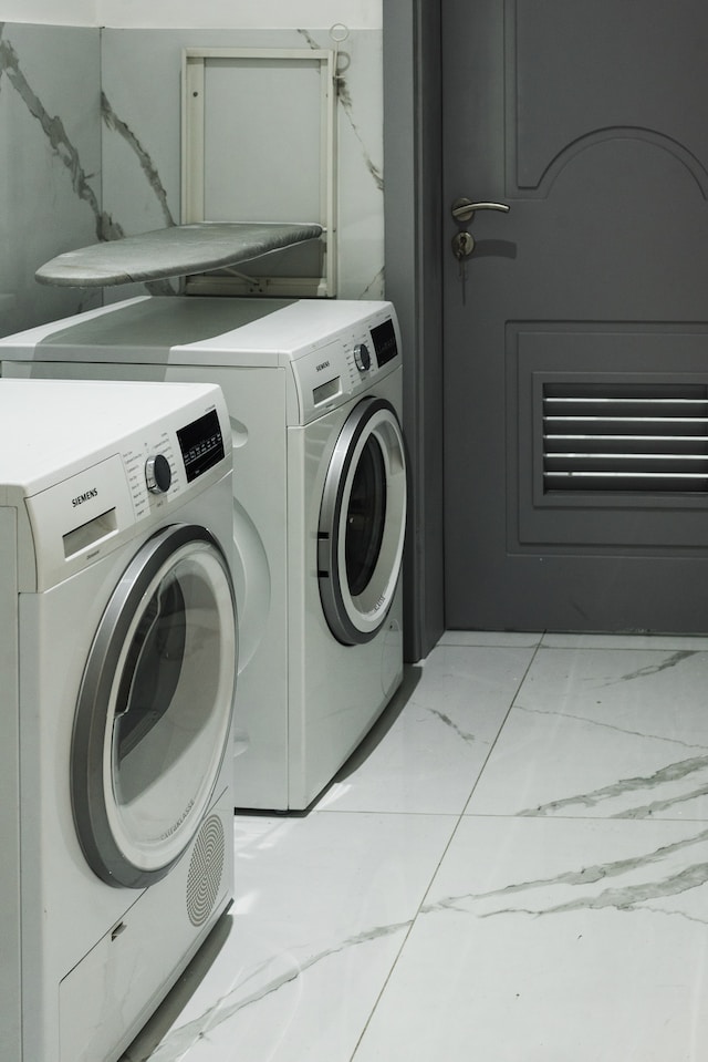 Grey washer and dryer in a laundry area